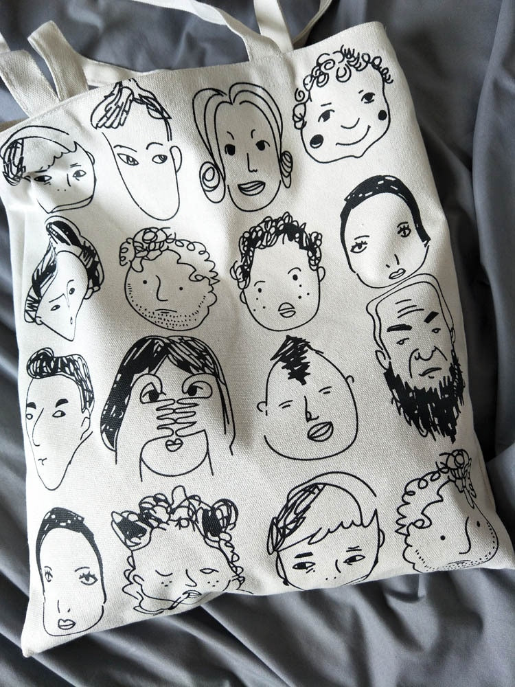 The Many Faces Tote Bag